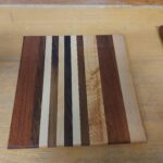 Maple, walnut and mahogany cutting board by Steve Hutcheon. Finished with that oil your give to animals to help them go crappie. (Castor Oil)